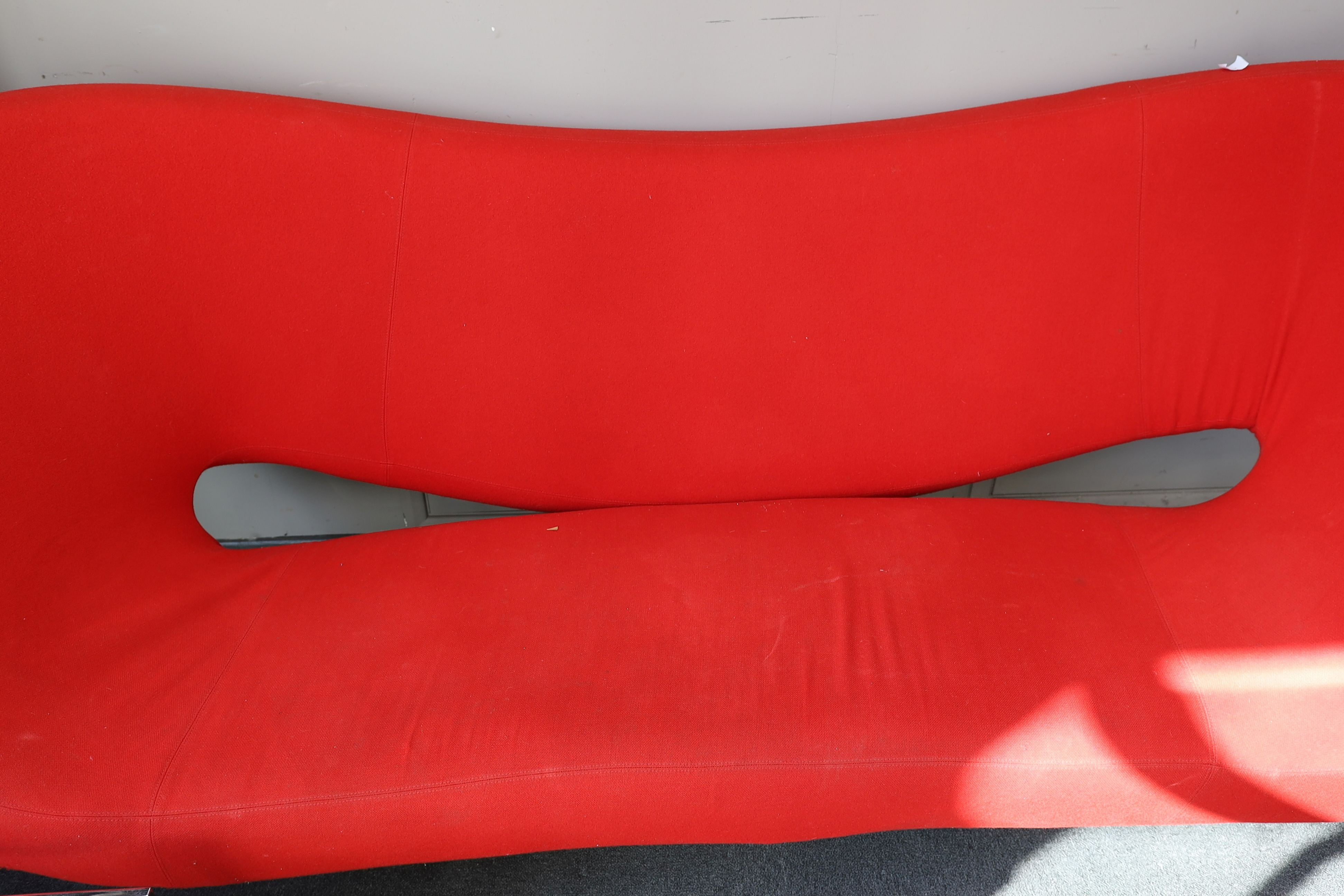 A Ron Arad, 'Moroso' sofa upholstered in red fabric, length 240cm, depth 94cm, height 100cm